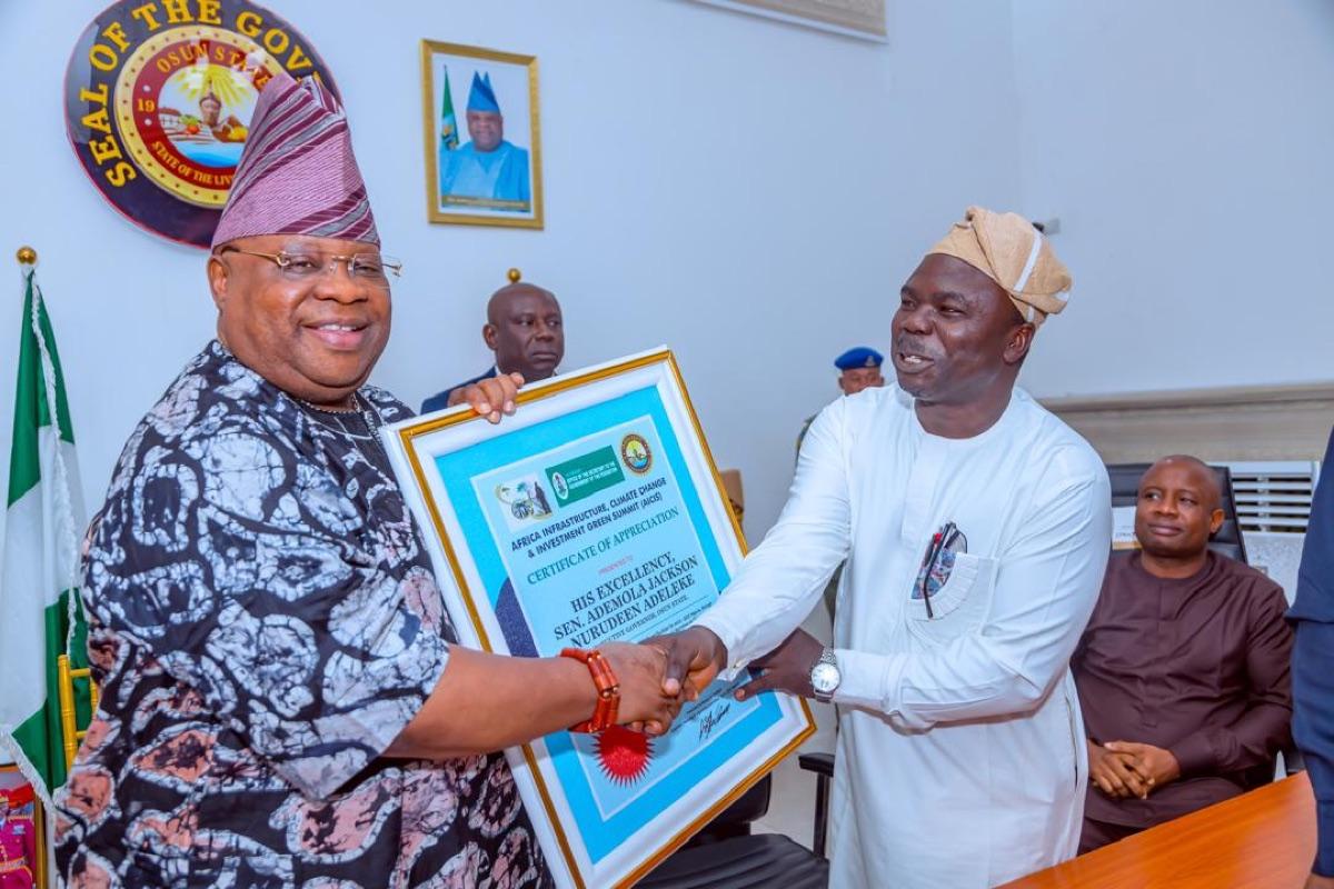 The Governor of Osun State receiving the Certificate of Appreciation from the Africa Infrastructure, Climate Change and Investment Green Summit