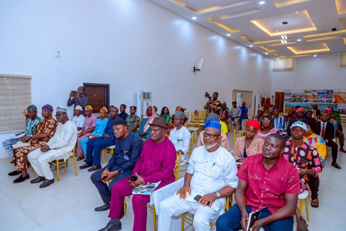 Large gathering of community members, government representatives, and civil society groups attending an Osun State climate action programme event
